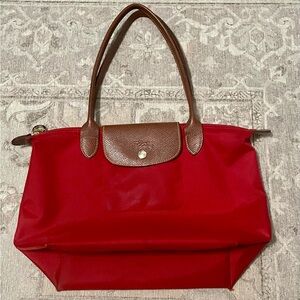 Longchamp Le Pilage bag medium size in red. Used but life left!